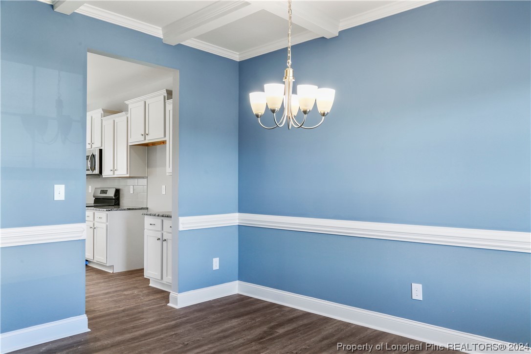 254 Collier Street Linden, NC 28356 - Photo 11 of 34 a view of empty room with wooden floor