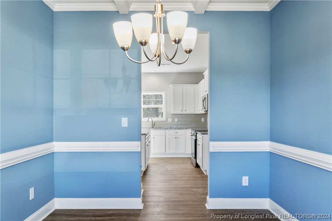 254 Collier Street Linden, NC 28356 - Photo 12 of 34 a view of kitchen with furniture and cabinets