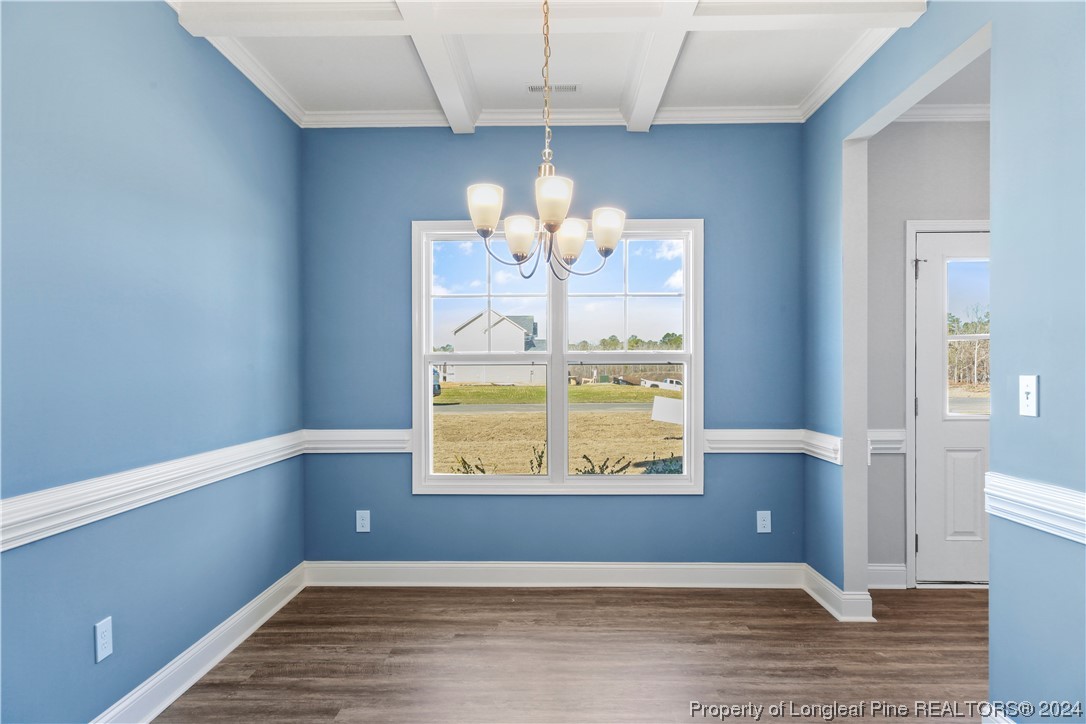 254 Collier Street Linden, NC 28356 - Photo 13 of 34 a view of kitchen with furniture and wooden floor