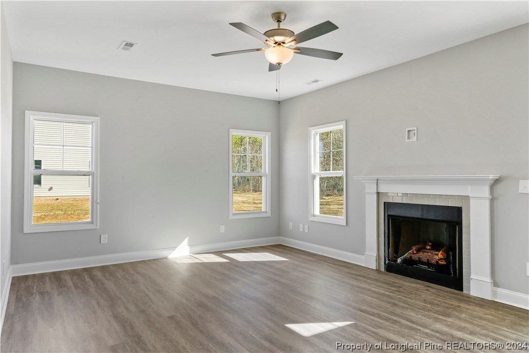 254 Collier Street Linden, NC 28356 - Photo 16 of 34 a view of an empty room with a window and fireplace