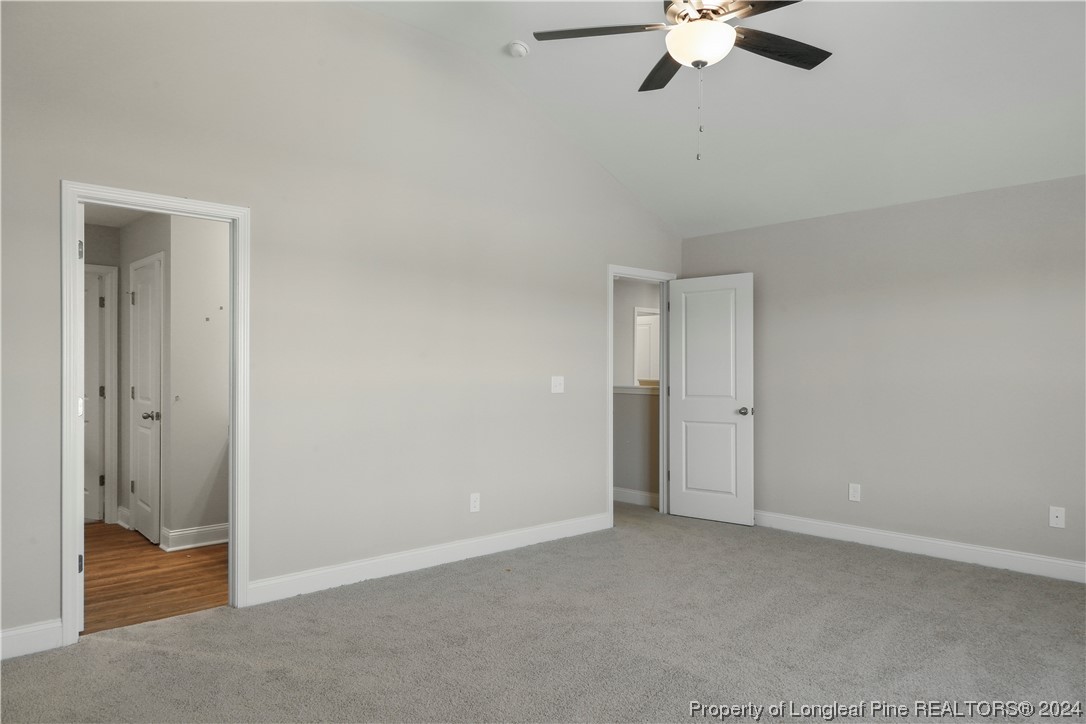 254 Collier Street Linden, NC 28356 - Photo 19 of 34 a view of an empty room and chandelier fan