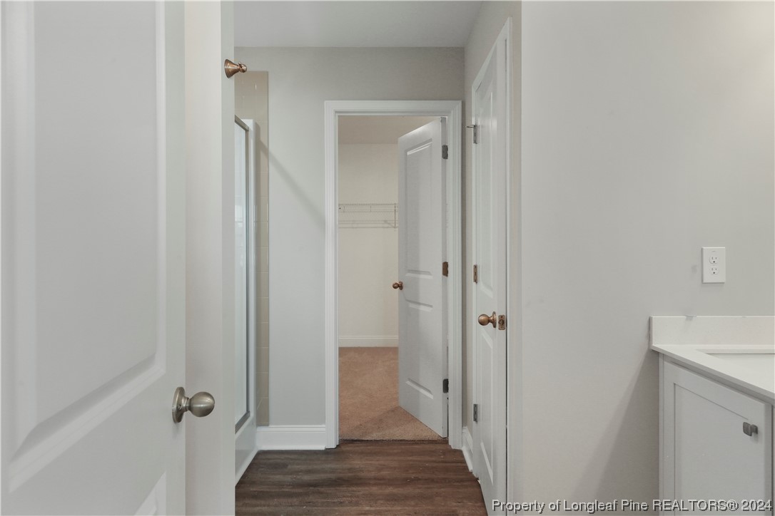 254 Collier Street Linden, NC 28356 - Photo 20 of 34 a view of a hallway with wooden floor and closet area