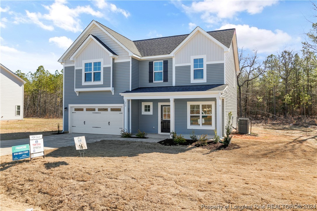 254 Collier Street Linden, NC 28356 - Photo 2 of 34 a front view of a house with a yard