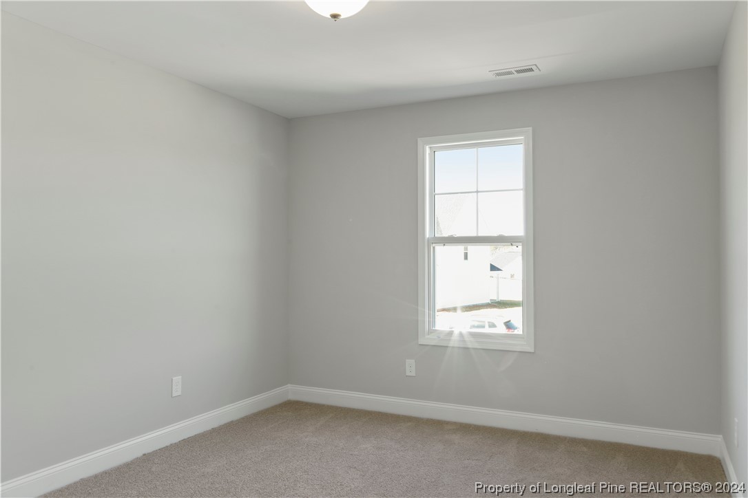254 Collier Street Linden, NC 28356 - Photo 27 of 34 a view of an empty room with a window