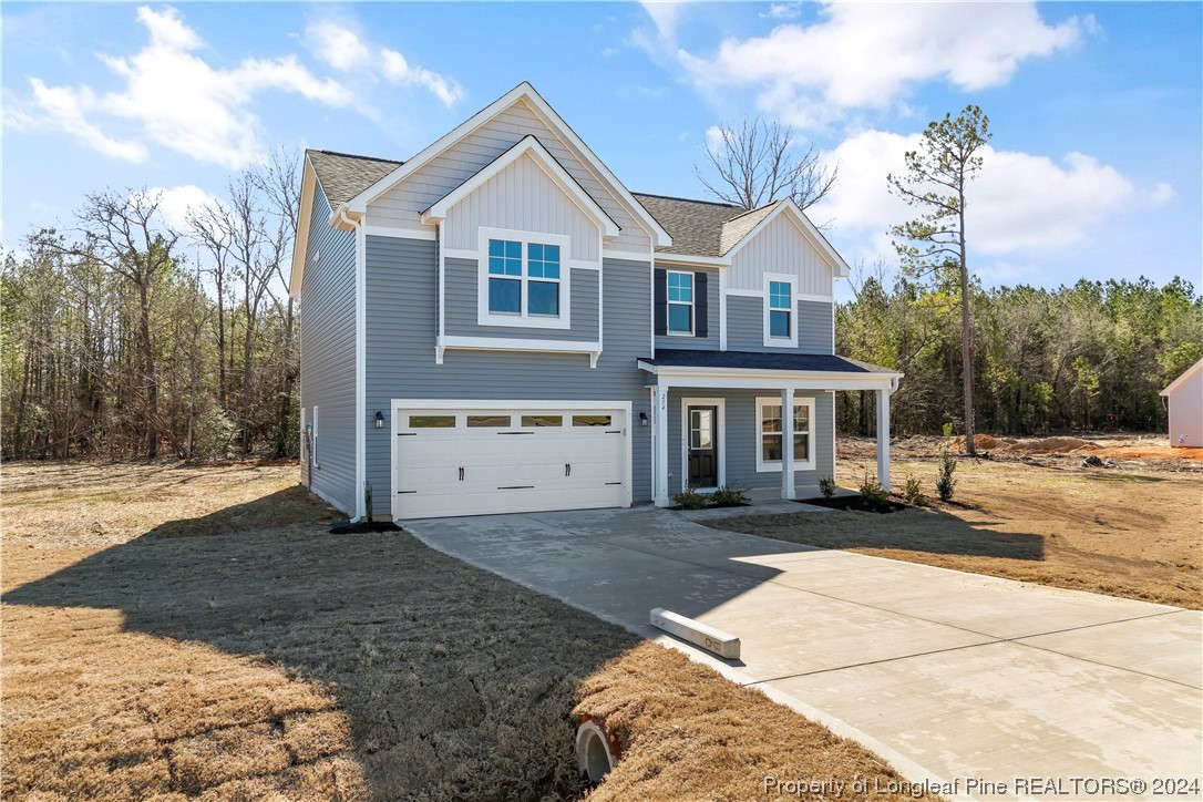 254 Collier Street Linden, NC 28356 - Photo 3 of 34 a front view of a house with a yard