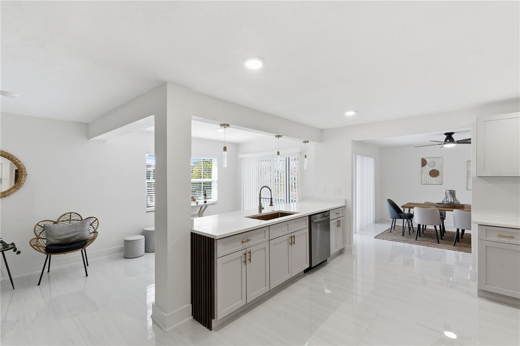 4346 Marine Parkway New Port Richey, FL 34652 - Photo 11 of 51 a living room with furniture a dining table and chairs