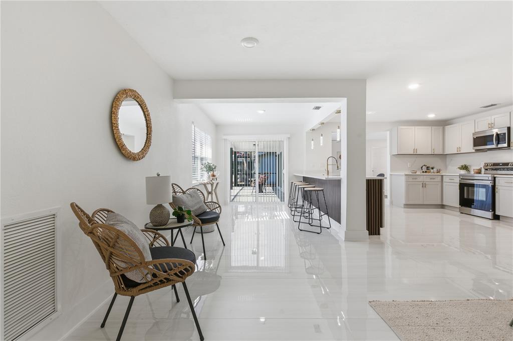 4346 Marine Parkway New Port Richey, FL 34652 - Photo 17 of 51 a view of kitchen with furniture and wooden floor