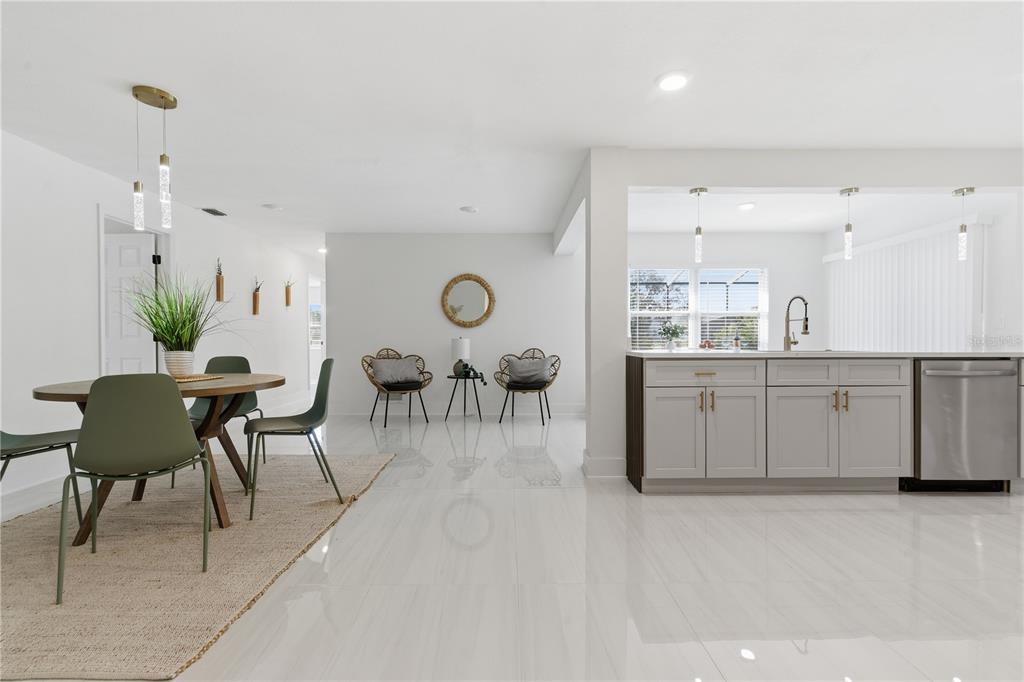 4346 Marine Parkway New Port Richey, FL 34652 - Photo 18 of 51 a view of a kitchen area with furniture and wooden floor