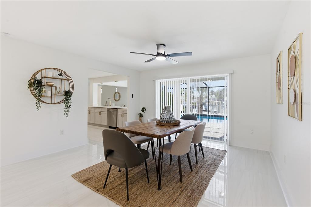 4346 Marine Parkway New Port Richey, FL 34652 - Photo 19 of 51 a view of a dining room with furniture window and wooden floor