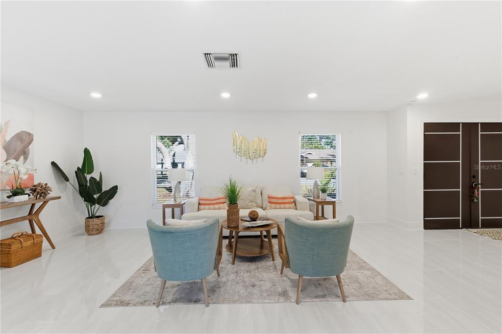 4346 Marine Parkway New Port Richey, FL 34652 - Photo 20 of 51 a dining room with furniture and a potted plant