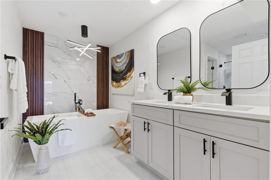 4346 Marine Parkway New Port Richey, FL 34652 - Photo 28 of 51 a bathroom with a double vanity sink and a mirror