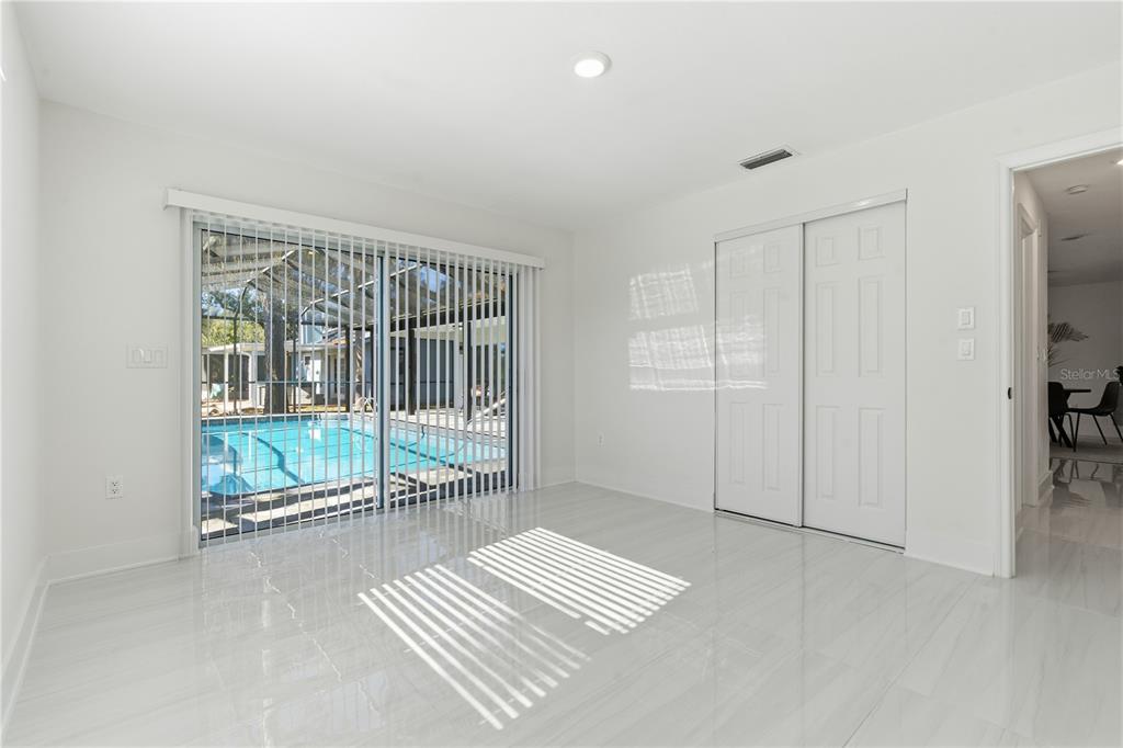 4346 Marine Parkway New Port Richey, FL 34652 - Photo 38 of 51 a view of an empty room with glass door