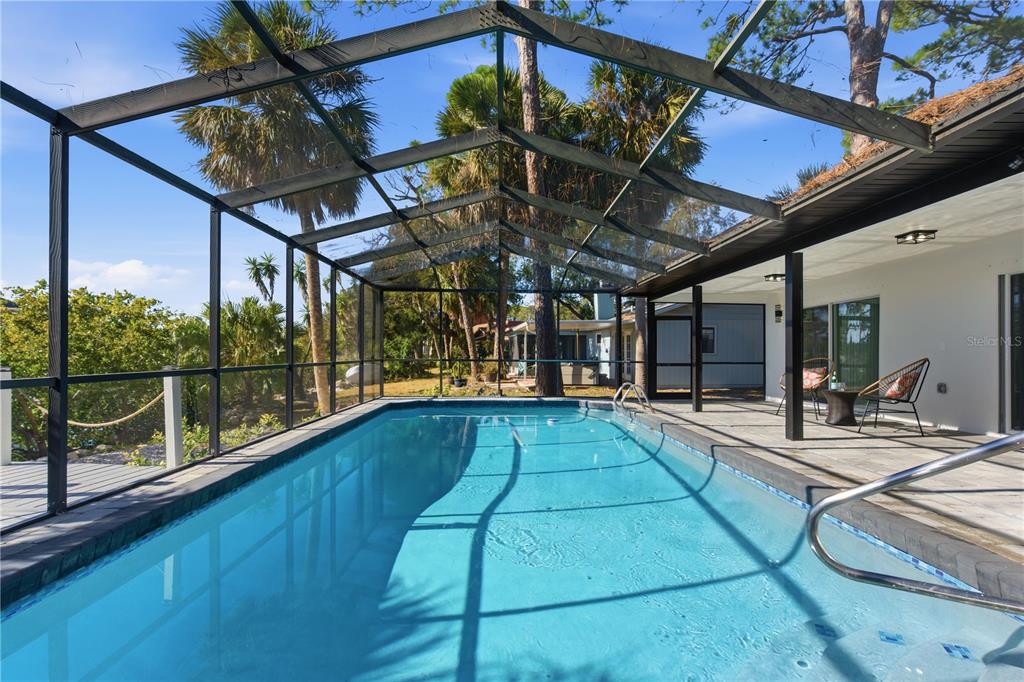4346 Marine Parkway New Port Richey, FL 34652 - Photo 44 of 51 a view of swimming pool with a patio