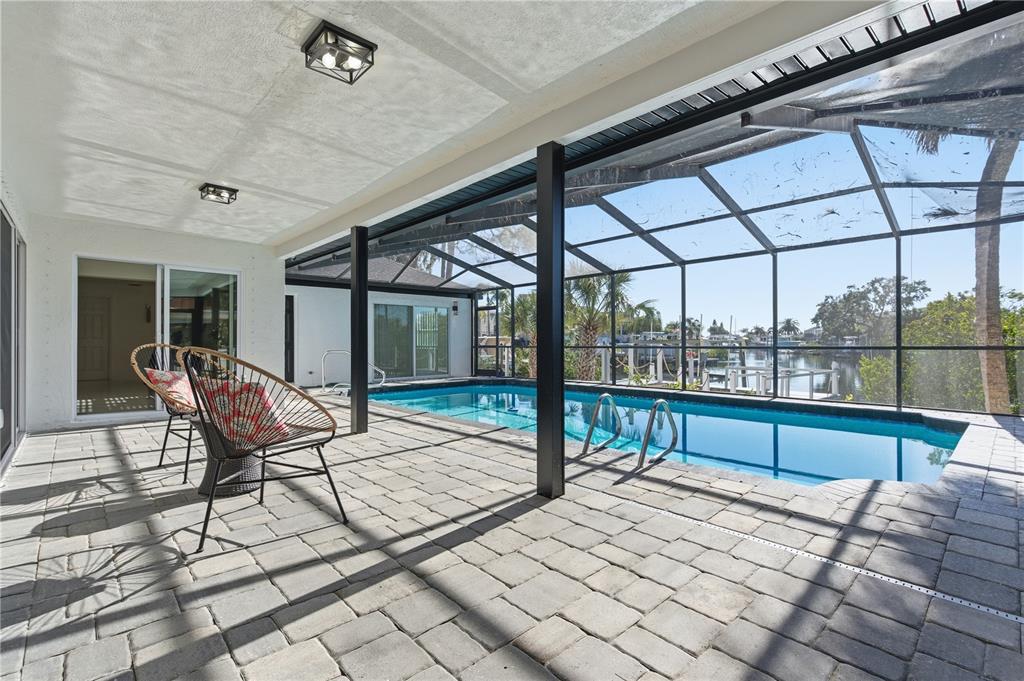 4346 Marine Parkway New Port Richey, FL 34652 - Photo 45 of 51 a building outdoor space with patio furniture and wooden floor