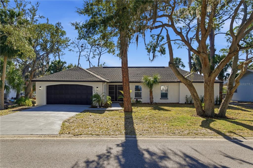 4346 Marine Parkway New Port Richey, FL 34652 - Photo 7 of 51 front view of a house with yard