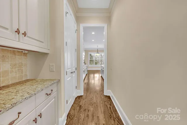 a large kitchen with stainless steel appliances granite countertop lots of counter space and a sink