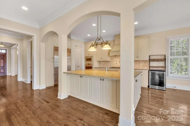 a view of a living room and wooden floor