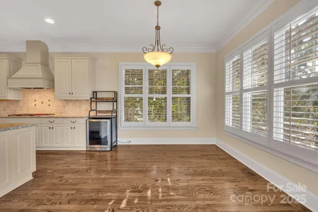 a room with water heater and wood floor