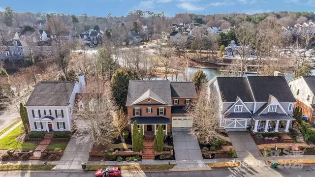 an aerial view of a residential apartment building with a street