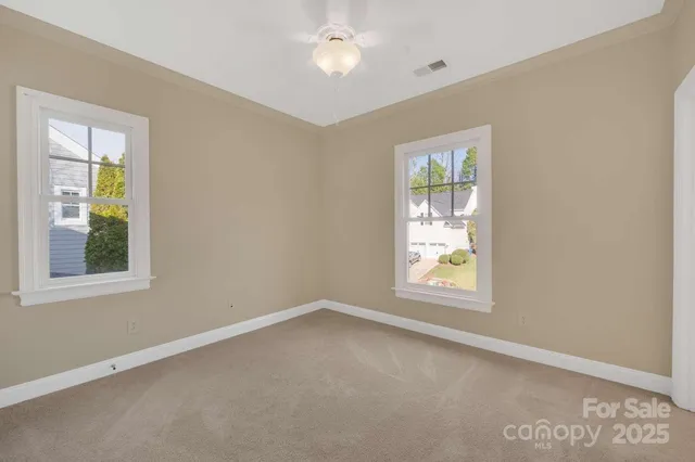 a spacious bathroom with a shower a sink and a mirror