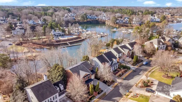 an aerial view of a house with a lake view