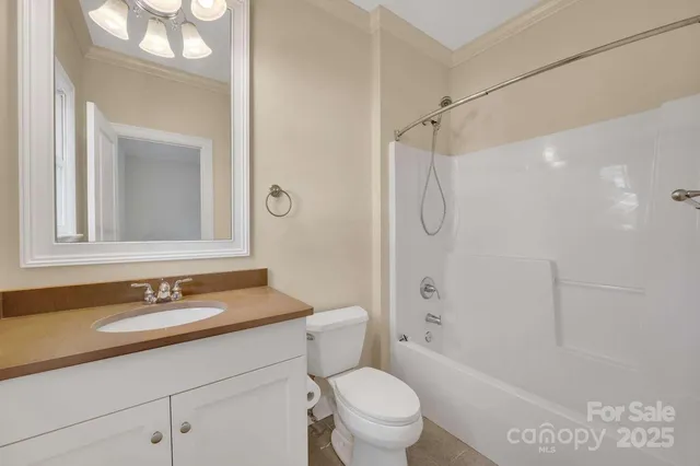 a bathroom with a tub and shower