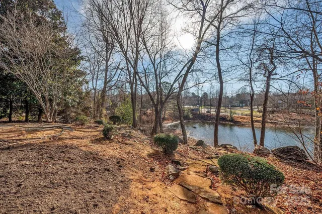 a view of a lake with outdoor seating