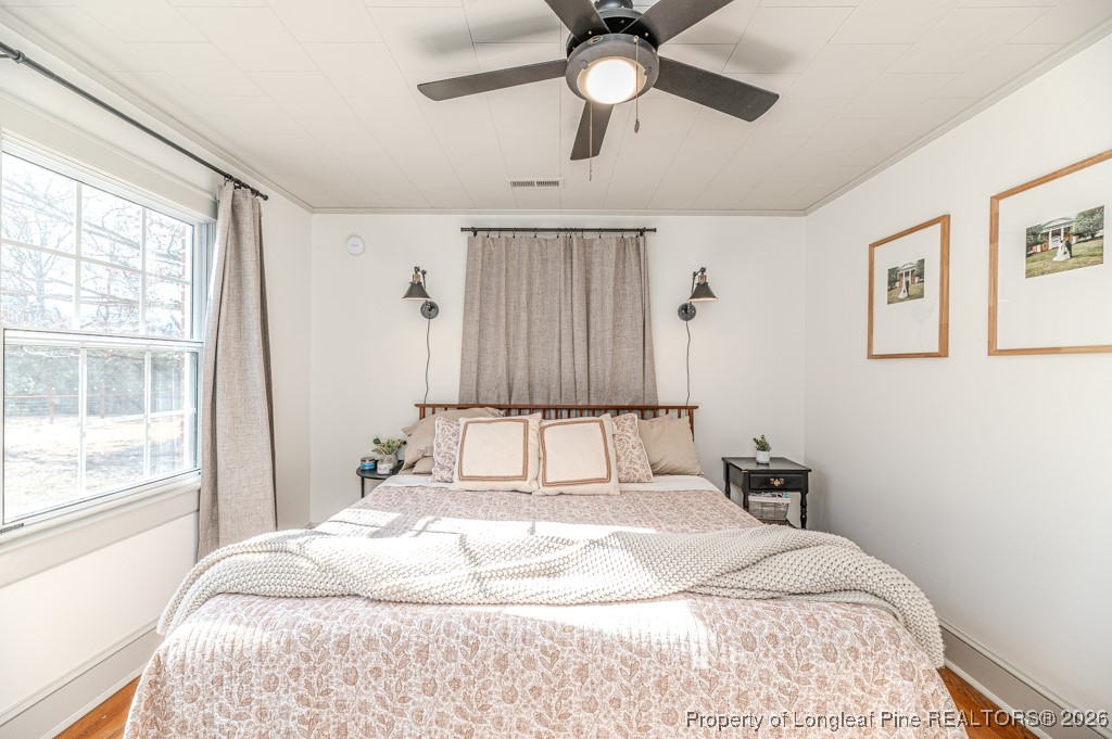 179 Sunset Hills Road Robbins, NC 27325 - Photo 19 of 31 a bedroom with a large bed and a window