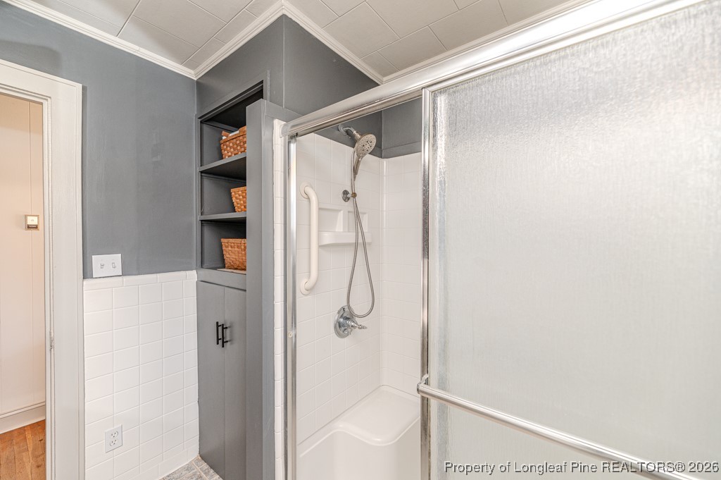 179 Sunset Hills Road Robbins, NC 27325 - Photo 21 of 31 a bathroom with a glass shower door
