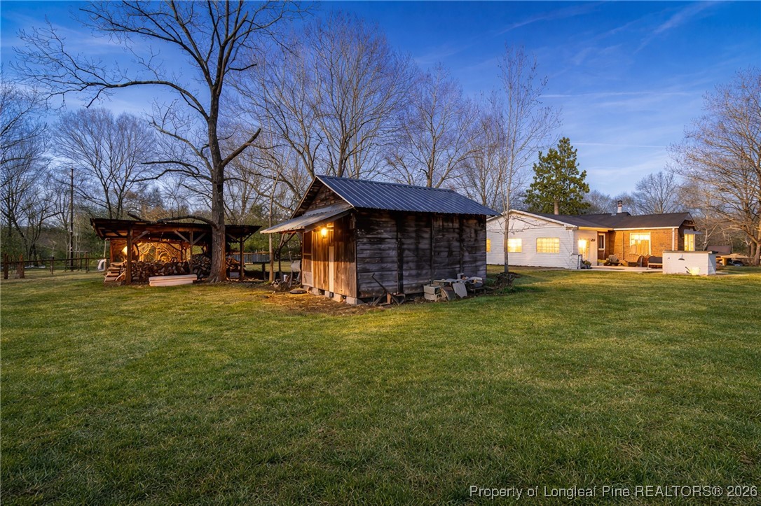 179 Sunset Hills Road Robbins, NC 27325 - Photo 30 of 31 a front view of a house with a garden