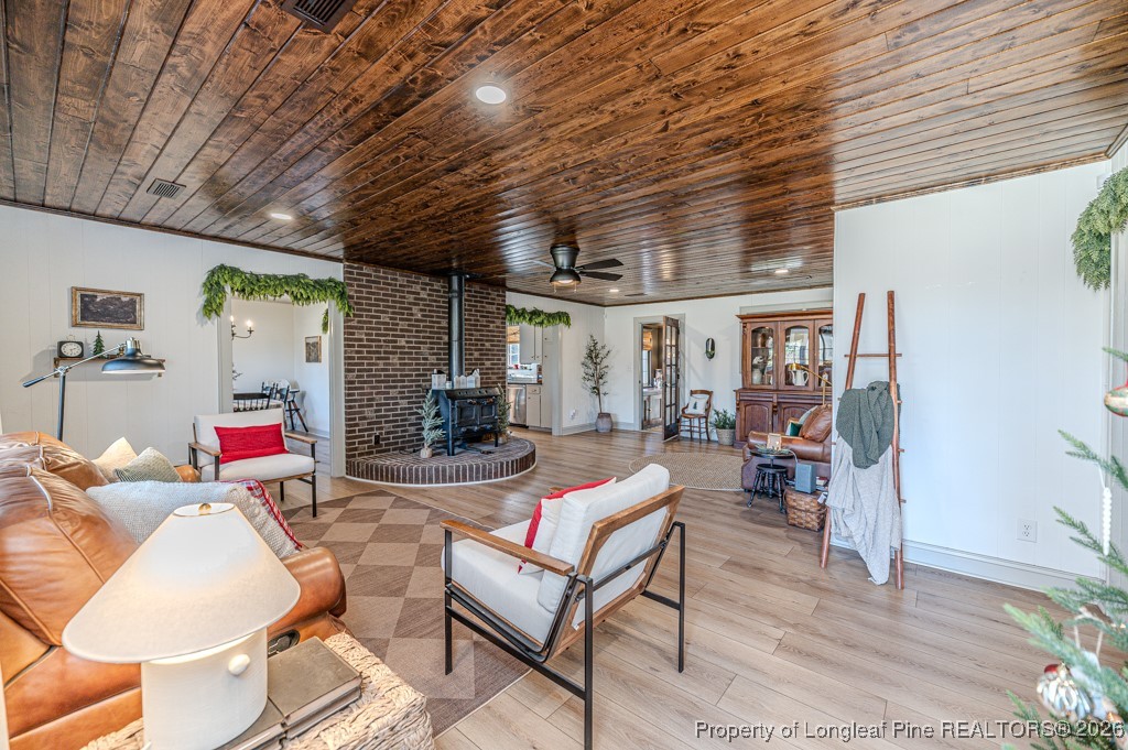 179 Sunset Hills Road Robbins, NC 27325 - Photo 3 of 31 a living room with furniture and a wooden floor