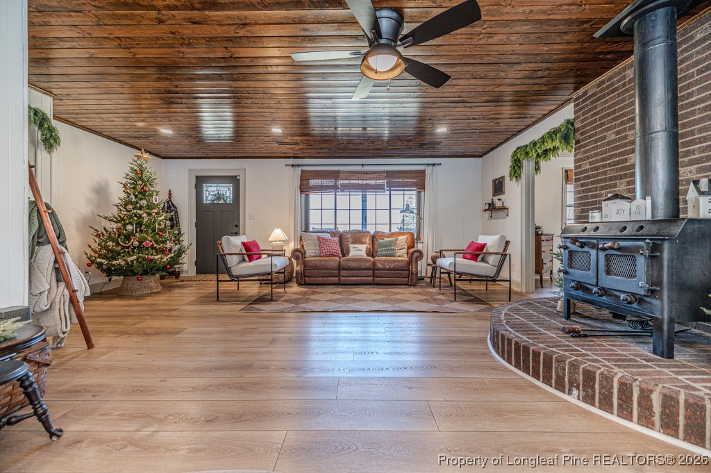 179 Sunset Hills Road Robbins, NC 27325 - Photo 5 of 31 a living room with furniture and flowers