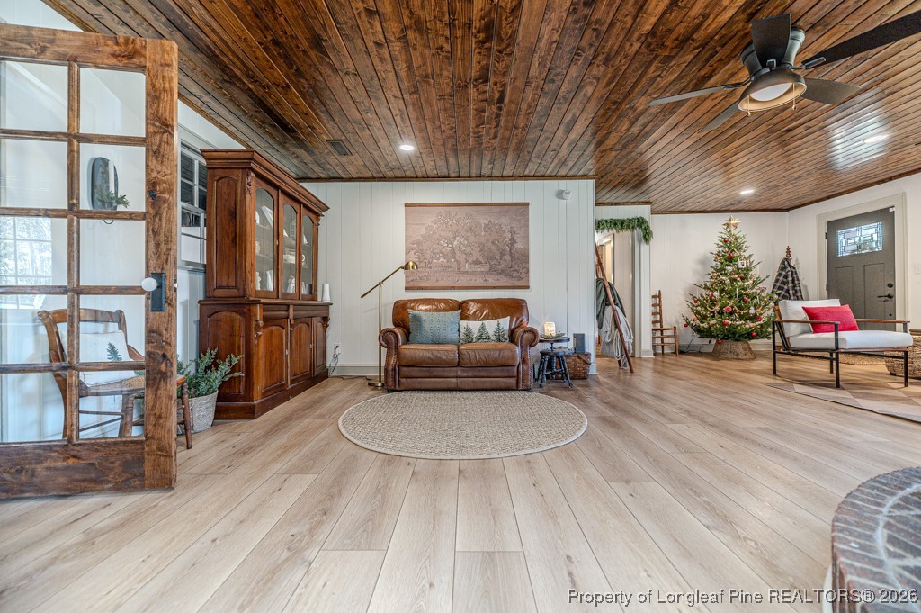 179 Sunset Hills Road Robbins, NC 27325 - Photo 6 of 31 a living room with furniture and a book shelf