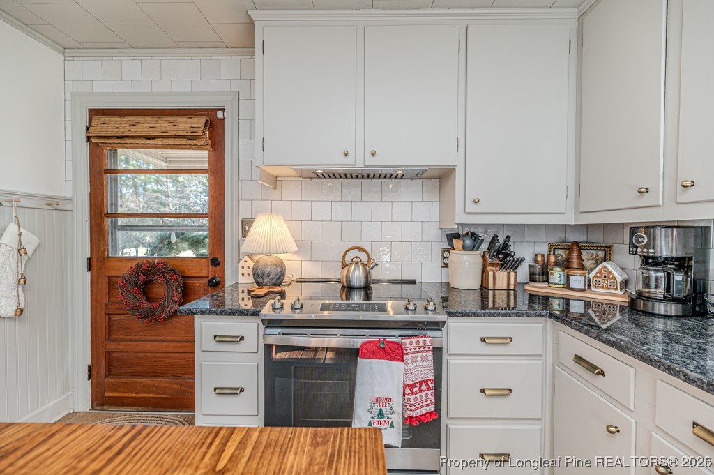 179 Sunset Hills Road Robbins, NC 27325 - Photo 8 of 31 a kitchen with granite countertop a sink and cabinets