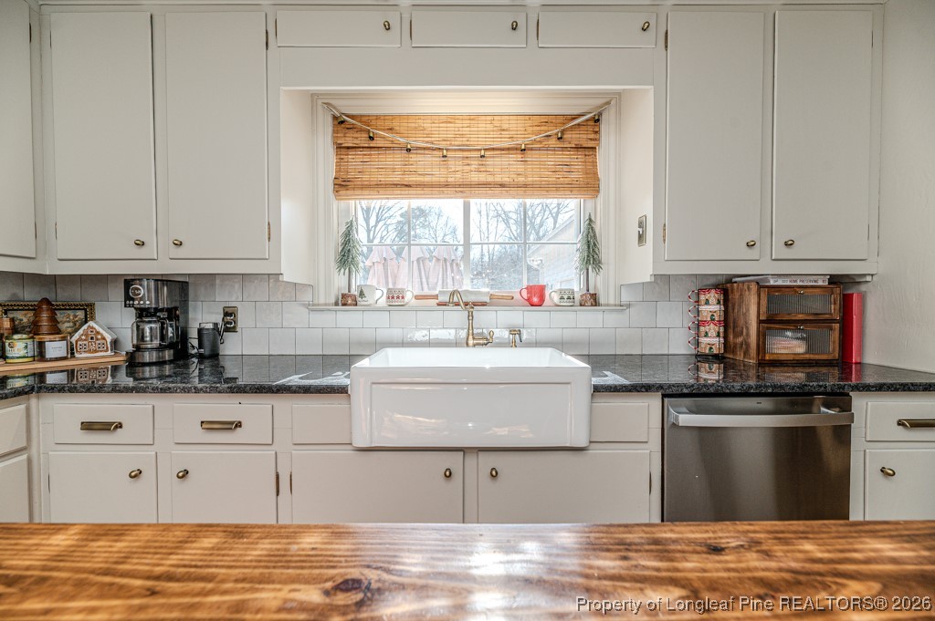 179 Sunset Hills Road Robbins, NC 27325 - Photo 10 of 31 a kitchen with stainless steel appliances granite countertop a sink and a stove
