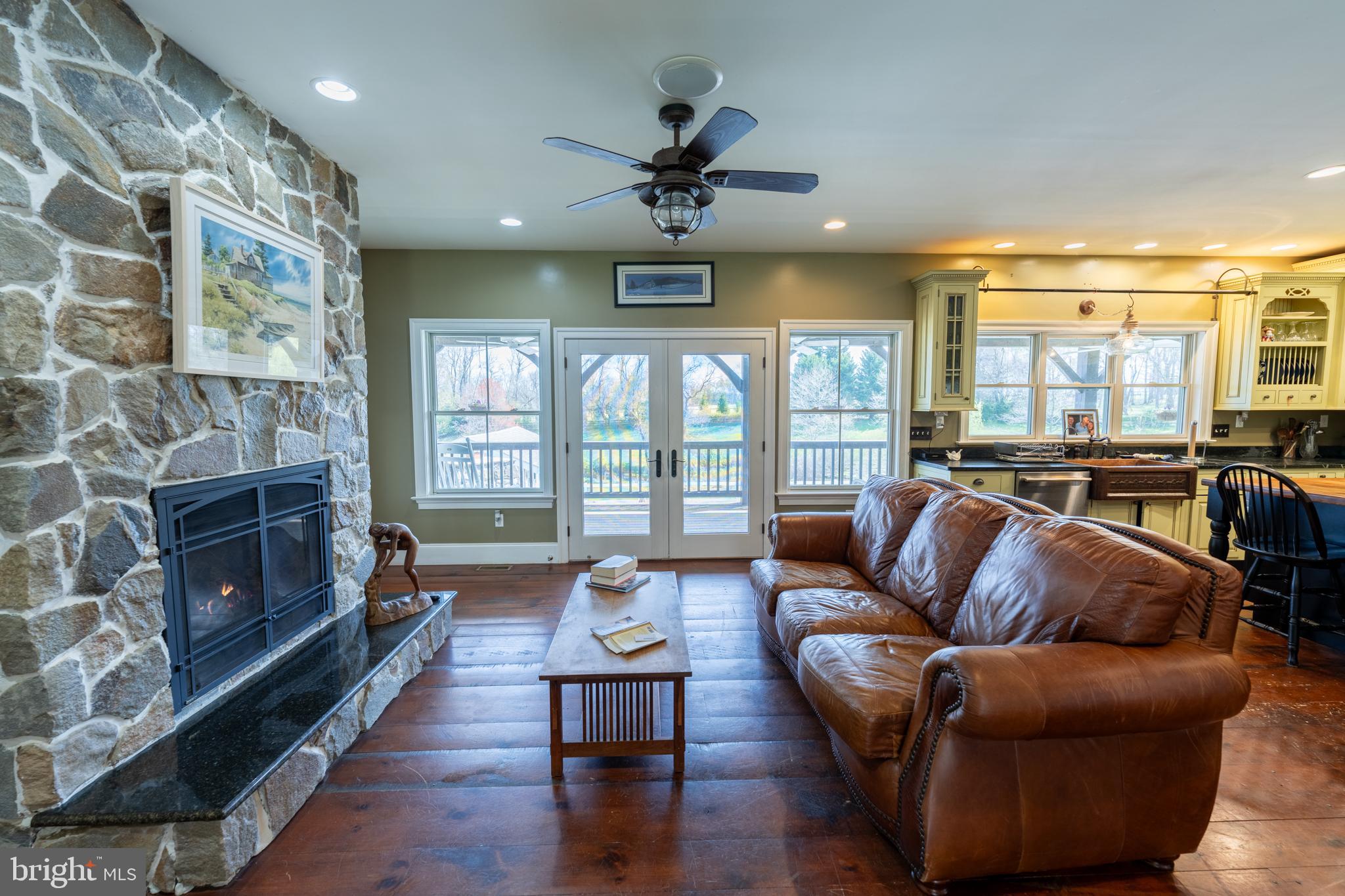 5727 Telegraph Road Elkton, MD 21921 - Photo 25 of 93 a living room with fireplace furniture and a floor to ceiling window