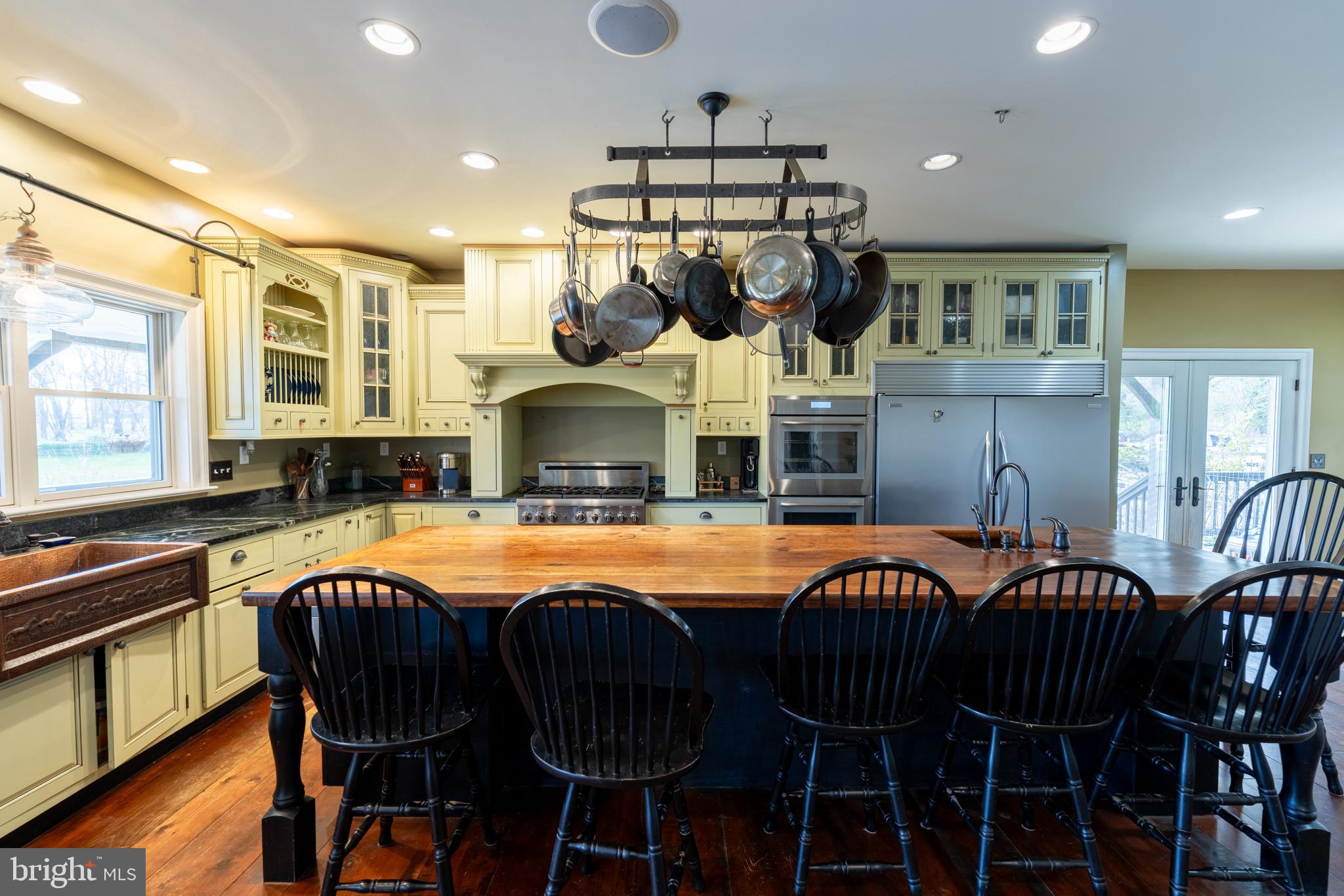 5727 Telegraph Road Elkton, MD 21921 - Photo 27 of 93 a open kitchen with stainless steel appliances granite countertop a stove a sink a dining table and chairs