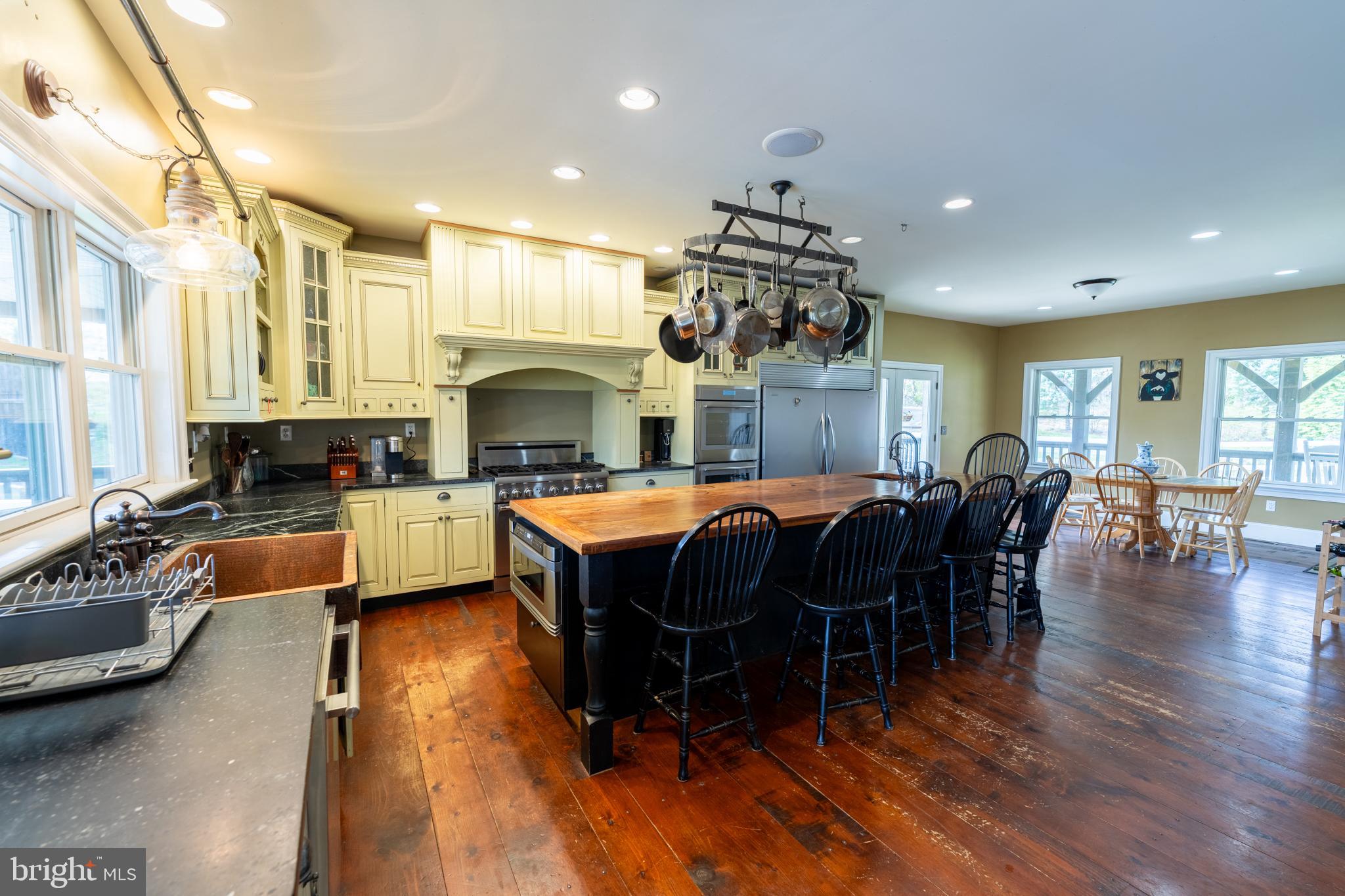 5727 Telegraph Road Elkton, MD 21921 - Photo 30 of 93 a living room with furniture a wooden floor and a fireplace
