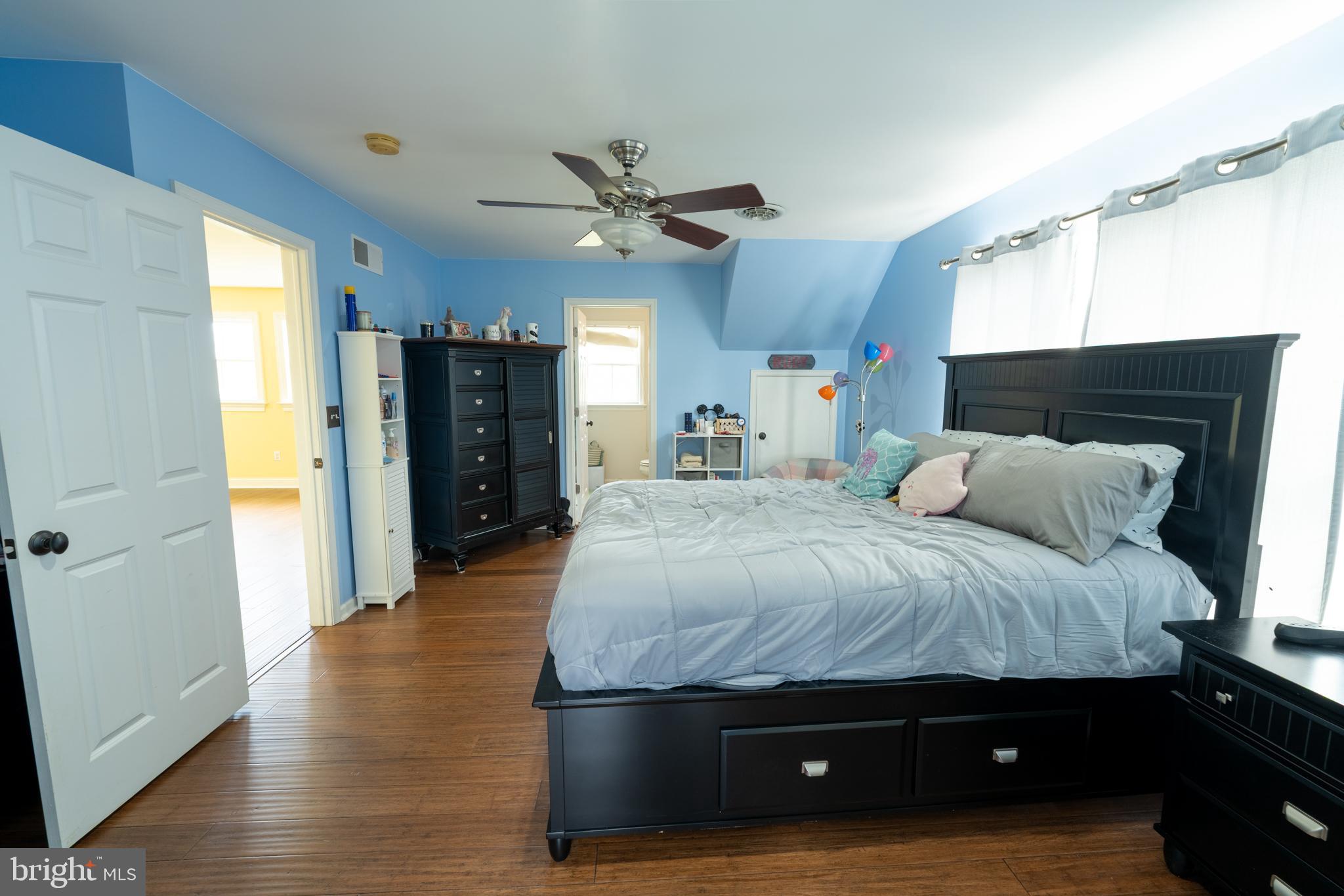 5727 Telegraph Road Elkton, MD 21921 - Photo 44 of 93 a spacious bedroom with a bed and wooden floor