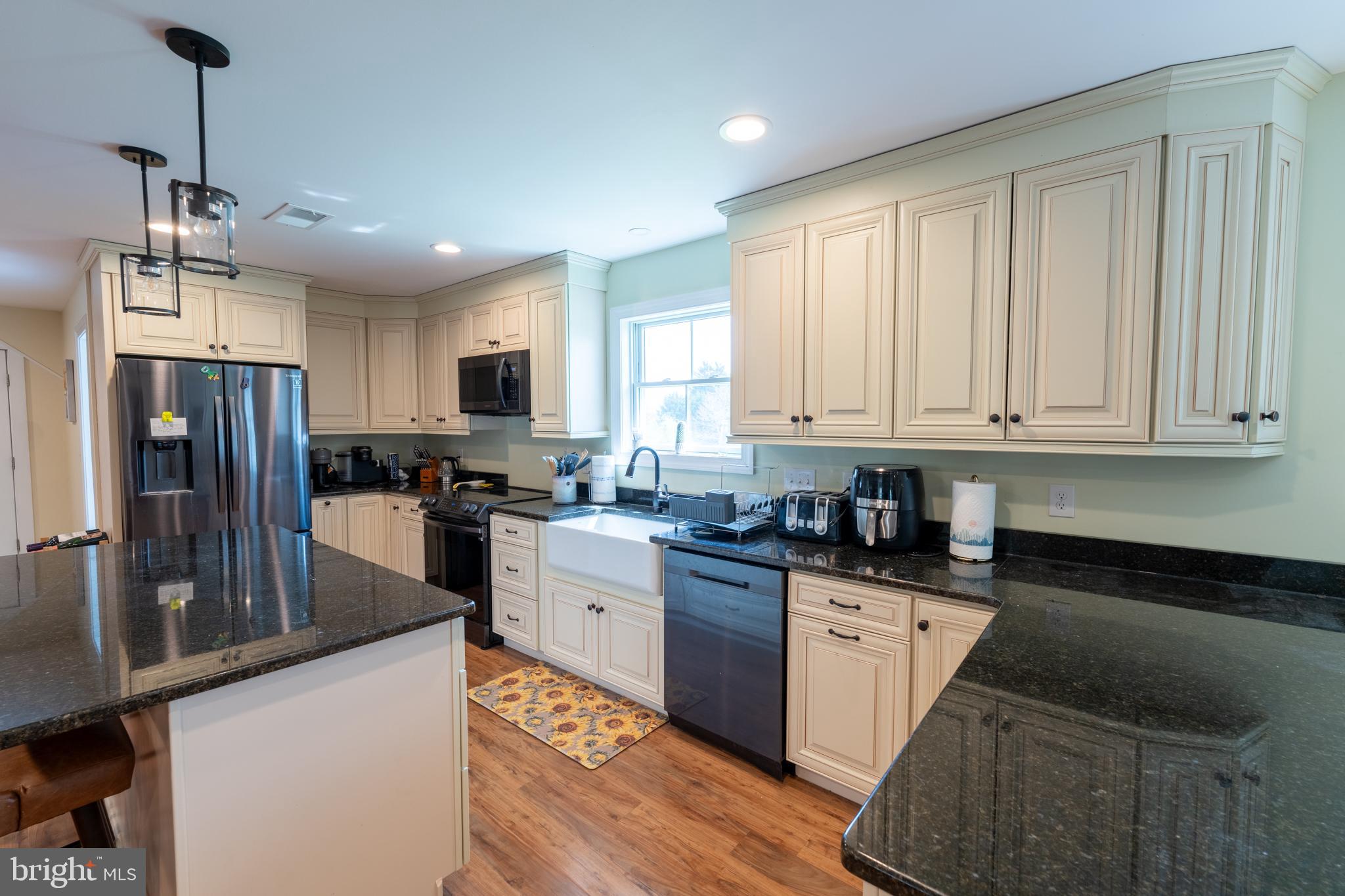 5727 Telegraph Road Elkton, MD 21921 - Photo 55 of 93 a kitchen with granite countertop a refrigerator stove top oven and sink