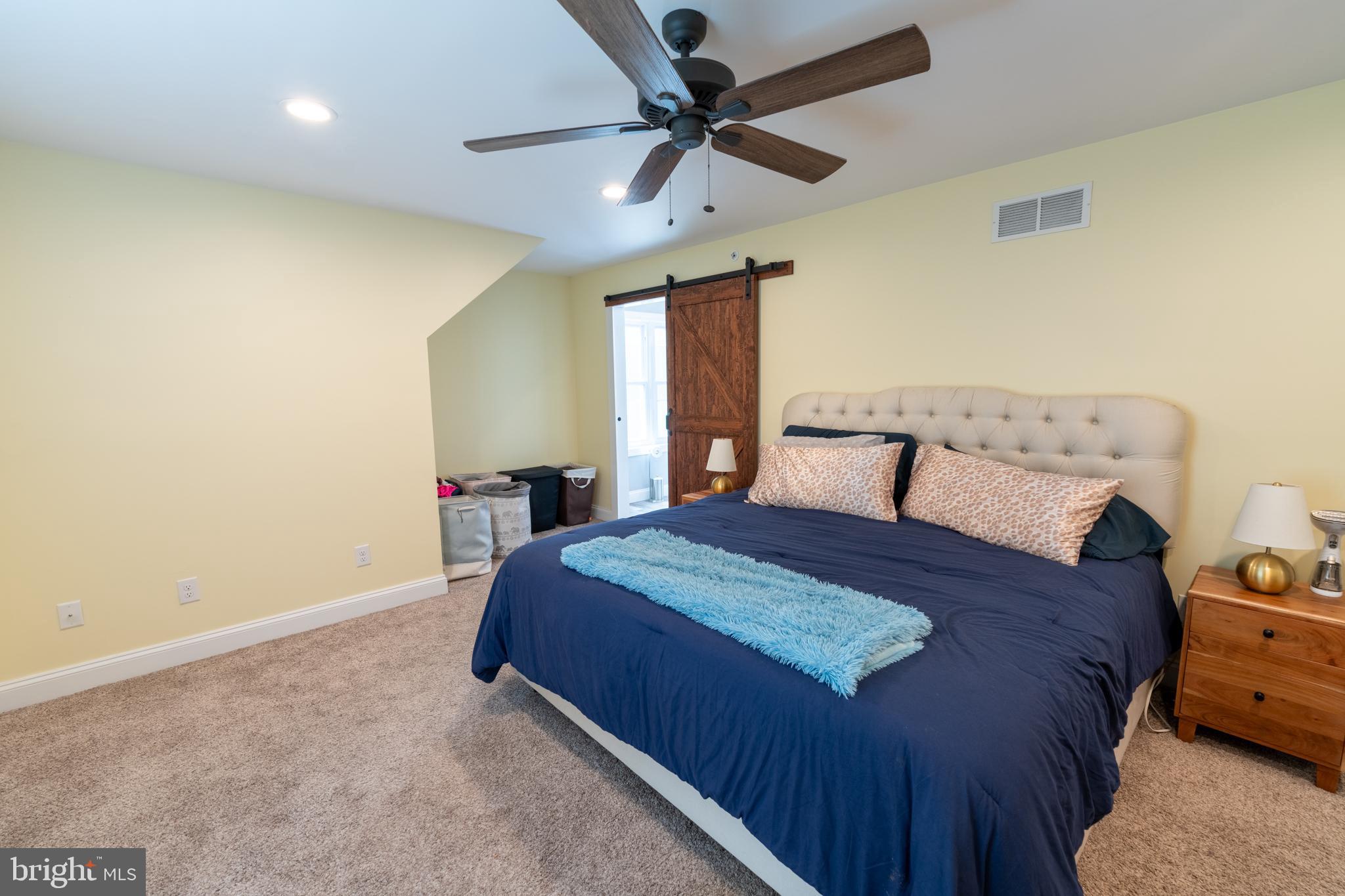 5727 Telegraph Road Elkton, MD 21921 - Photo 62 of 93 a bedroom with a bed and a ceiling fan