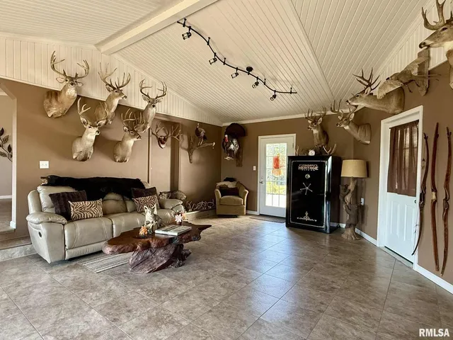 a view of a balcony with chairs and wooden floor