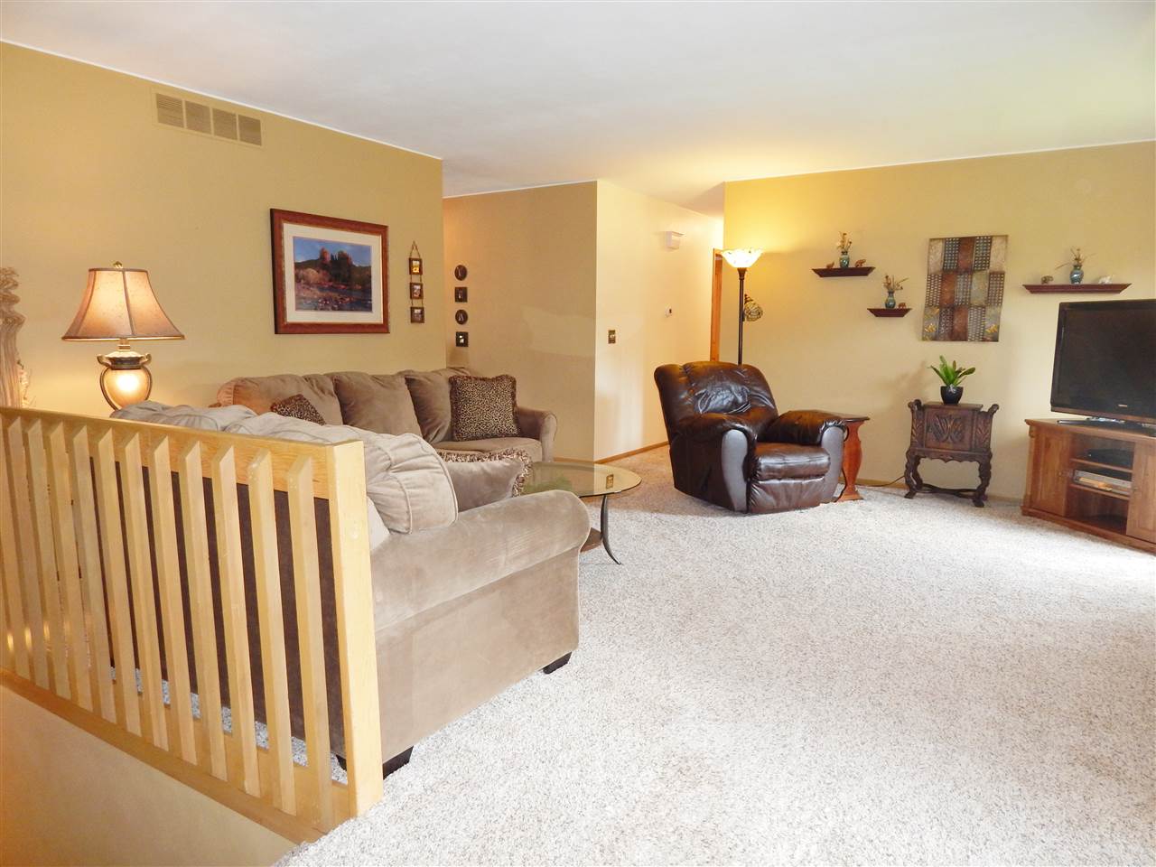 4259 Montclair Road Roscoe, IL 61073 - Photo 12 of 25 a bedroom with furniture and a flat screen tv