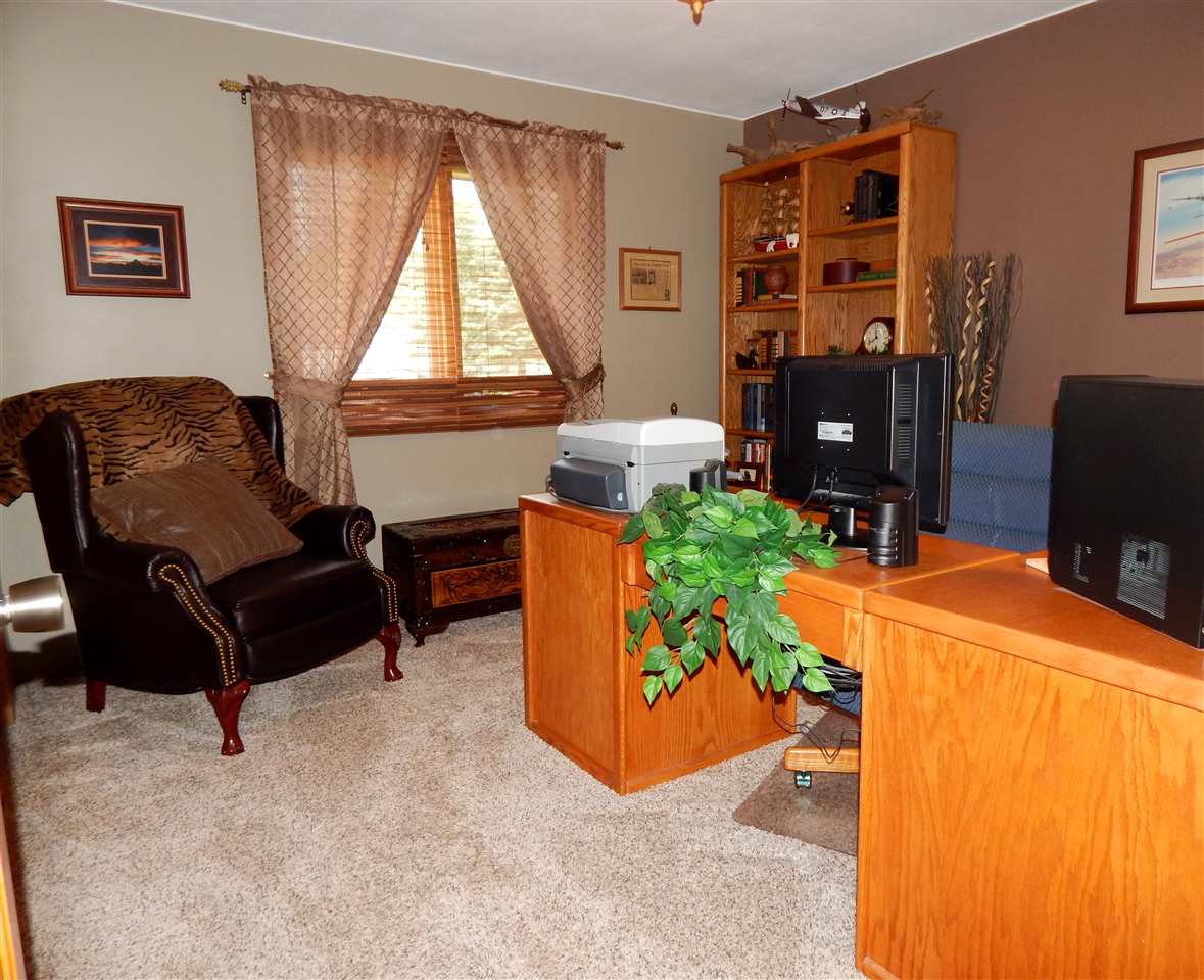 4259 Montclair Road Roscoe, IL 61073 - Photo 16 of 25 a living room with furniture and a window