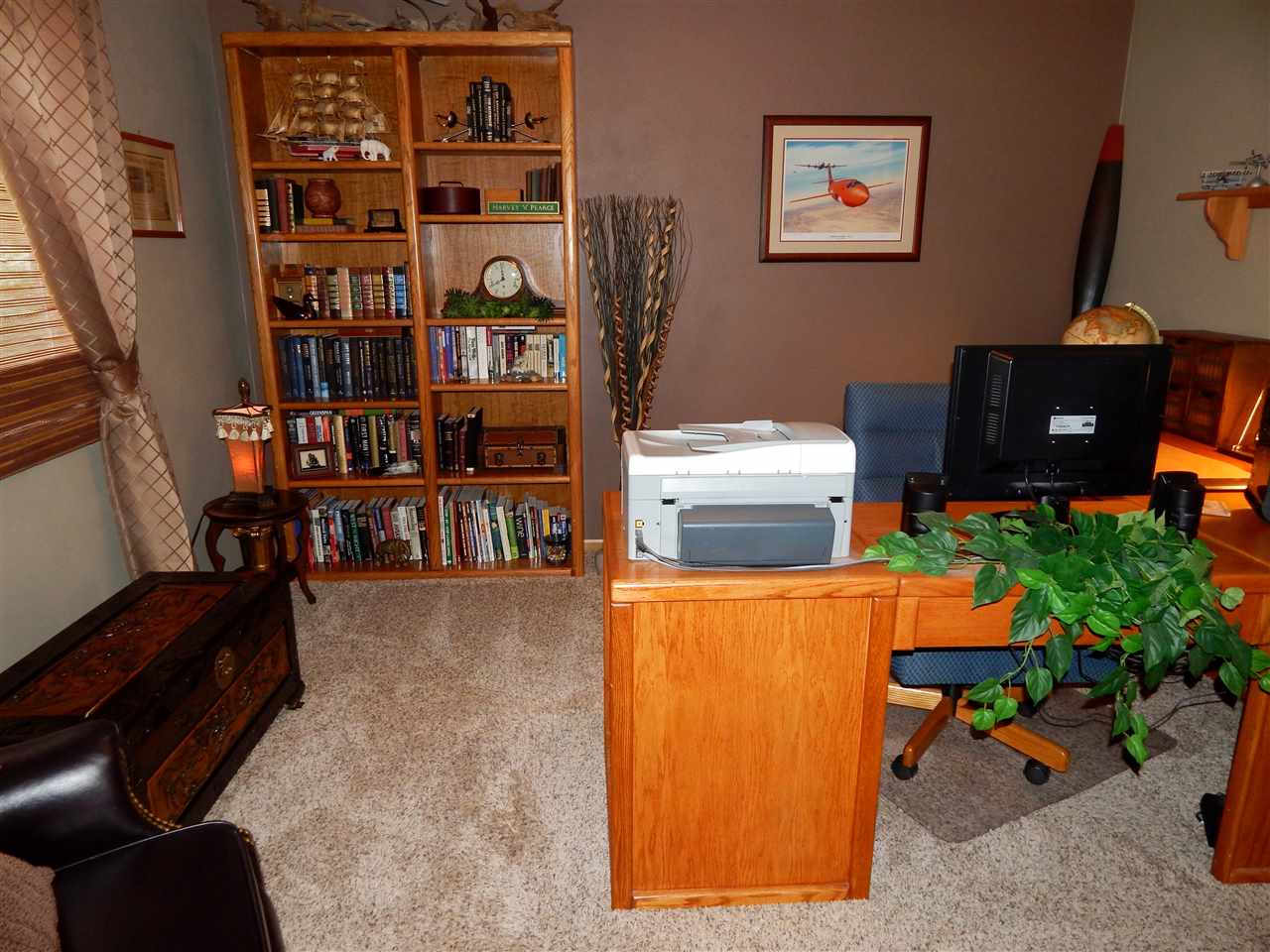 4259 Montclair Road Roscoe, IL 61073 - Photo 17 of 25 a room with furniture and book shelf