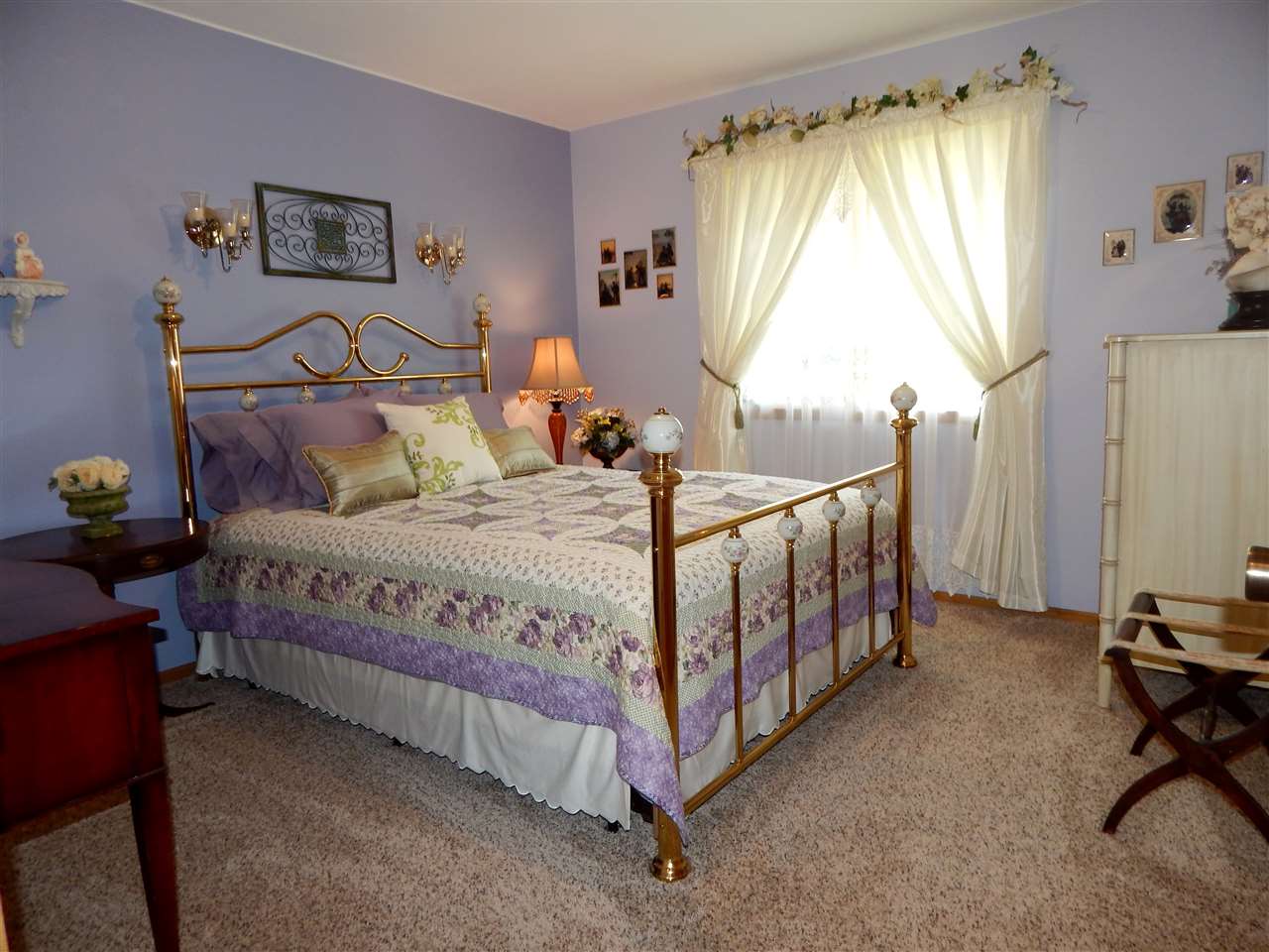 4259 Montclair Road Roscoe, IL 61073 - Photo 18 of 25 a bedroom with a bed a table and a dresser