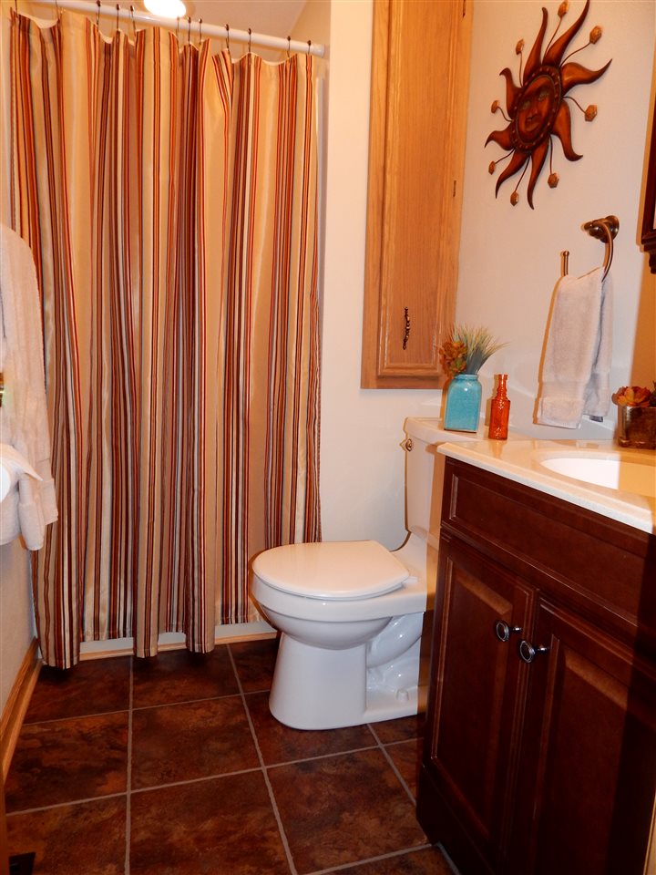 4259 Montclair Road Roscoe, IL 61073 - Photo 21 of 25 a bathroom with a toilet and a sink