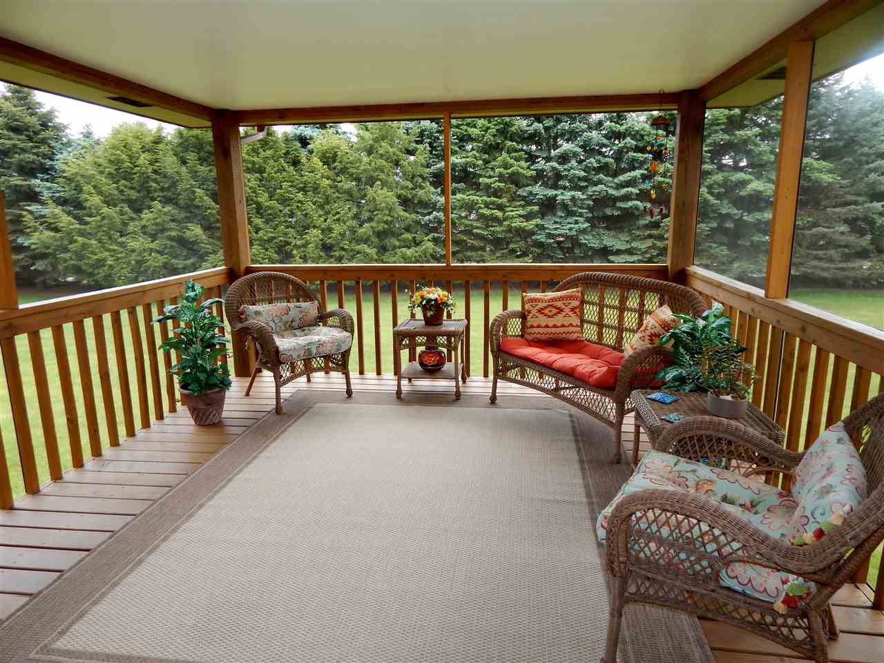 4259 Montclair Road Roscoe, IL 61073 - Photo 3 of 25 a balcony with furniture and wooden floor