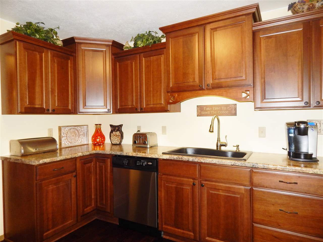 4259 Montclair Road Roscoe, IL 61073 - Photo 8 of 25 a kitchen with granite countertop a sink cabinets and stainless steel appliances