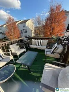 a view of a wooden chairs in patio of the house